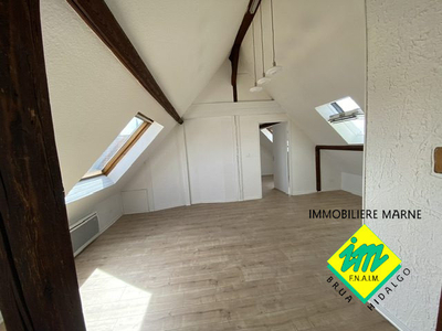 Duplex attique rue de Reims