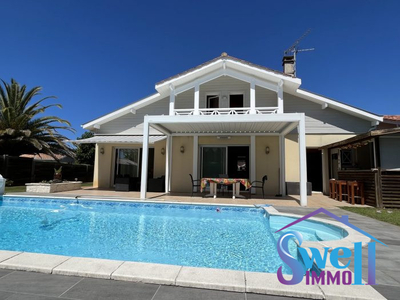 Villa T7 165m² piscine chauffée, garage, dépendance sur beau jardin clos